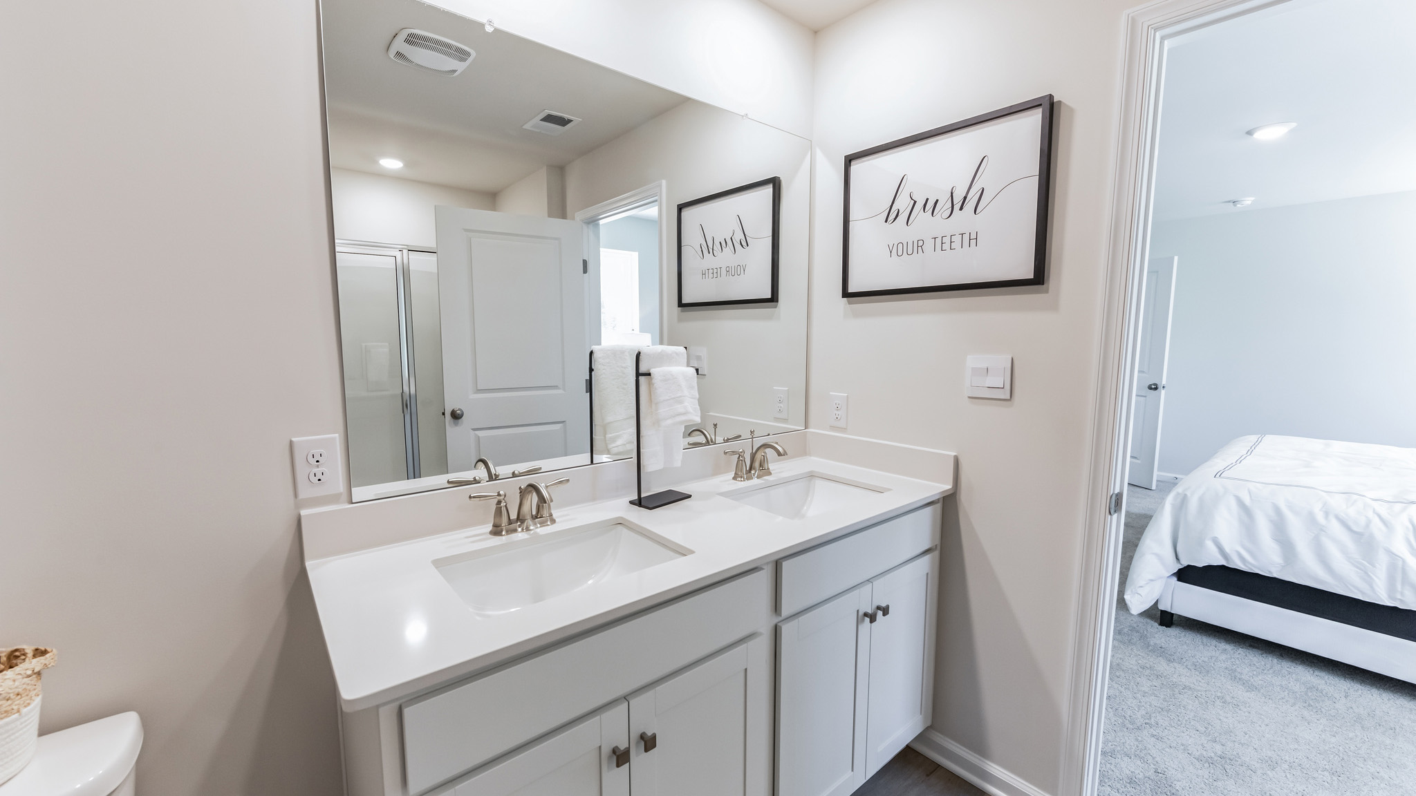 A double-bowl vanity adorns the primary bathroom.