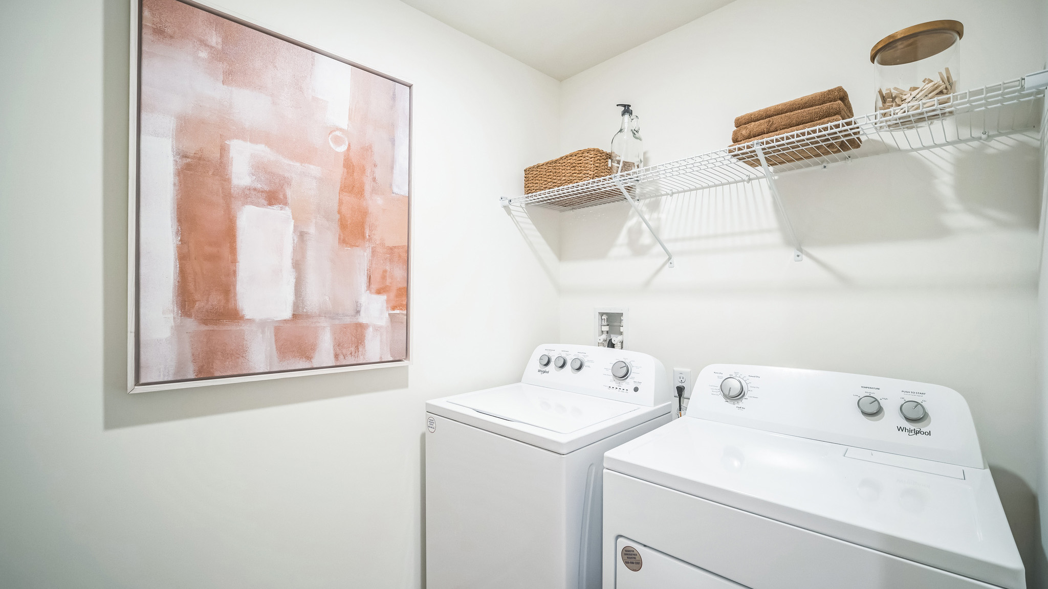 Laundry closet with a washing machine and dryer