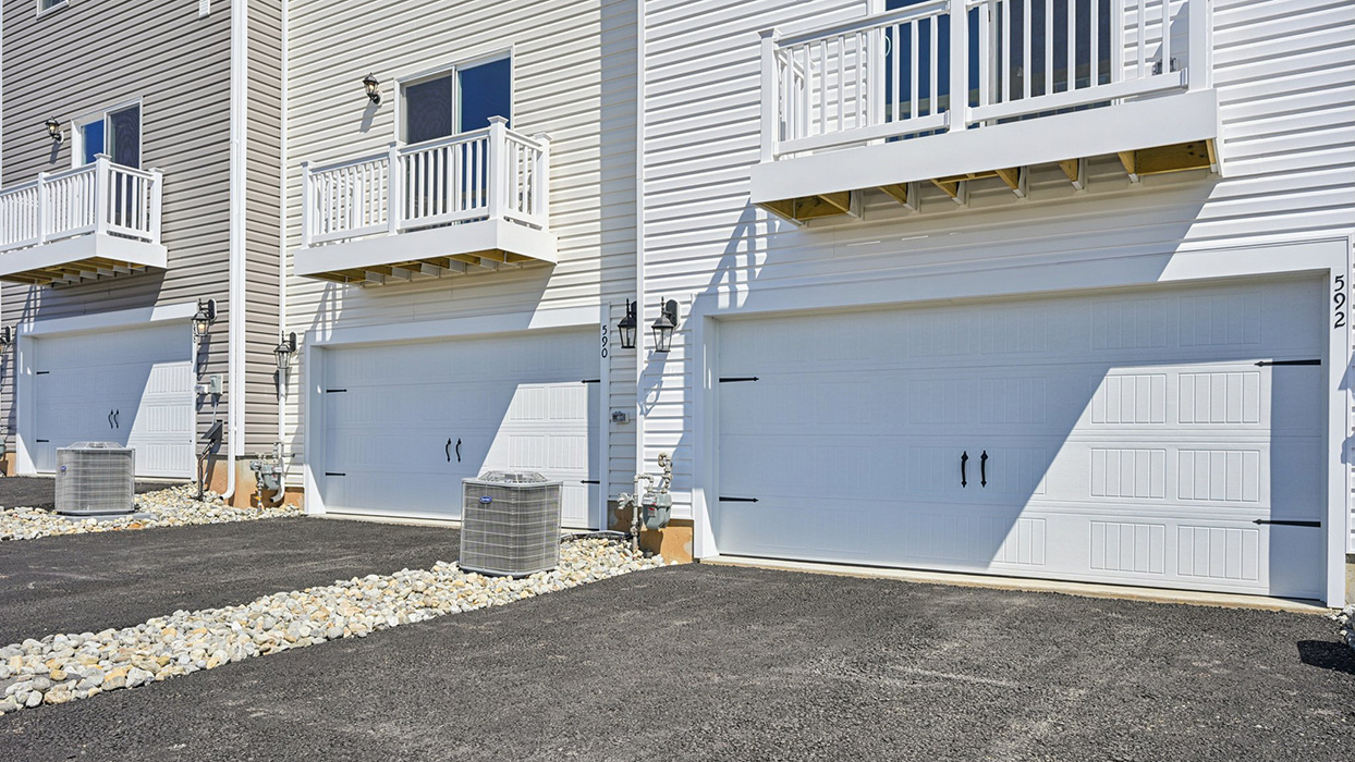 A view of the two car garage on the rear side of home
