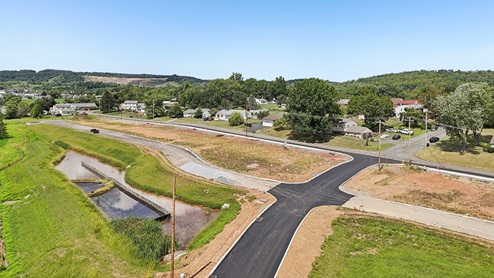 A low aerial photo of the community looking towards Swamp Creek Road