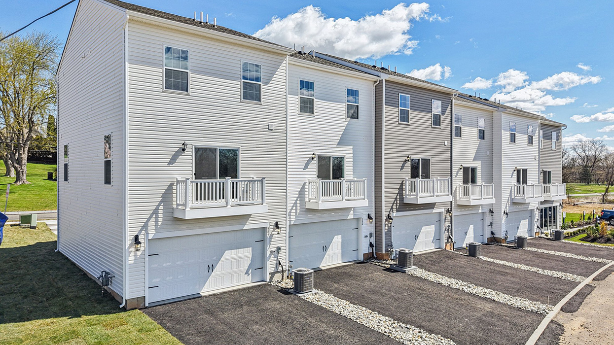 A drone aerial view of the a 6 unit townhome building