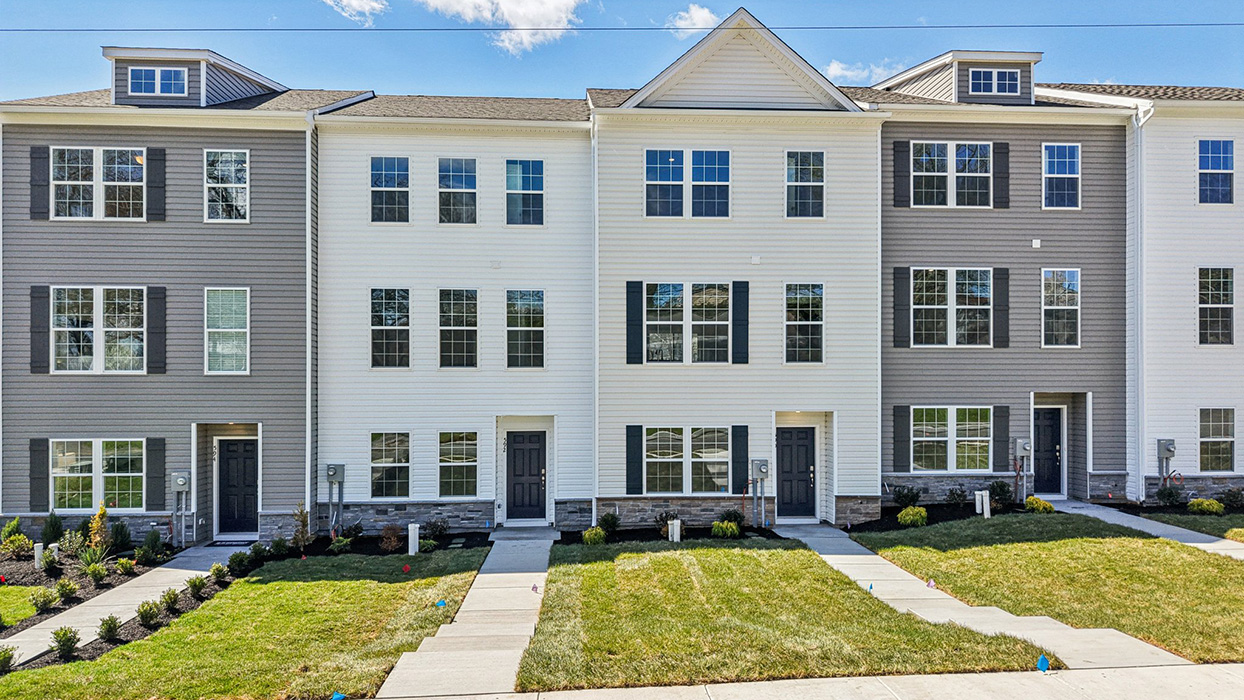 a front view of a townhome in linen color