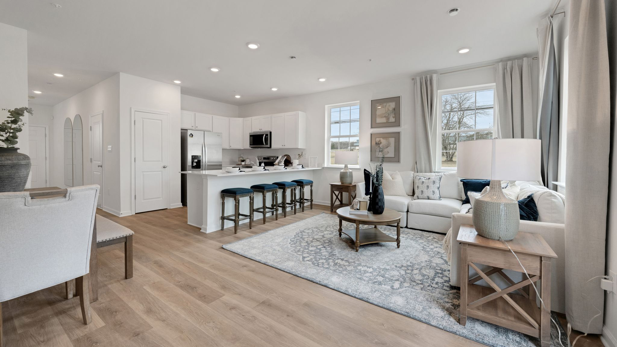 Part of the living and kitchen counter area. Dining area in the back left.