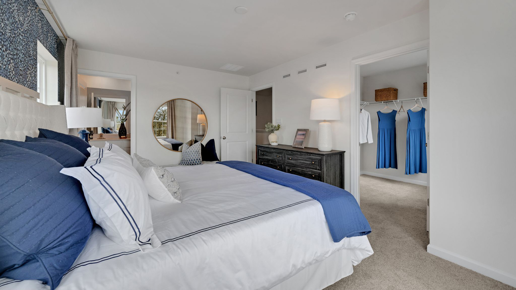 A different view of the primary bedroom looking into the second floor hallway.