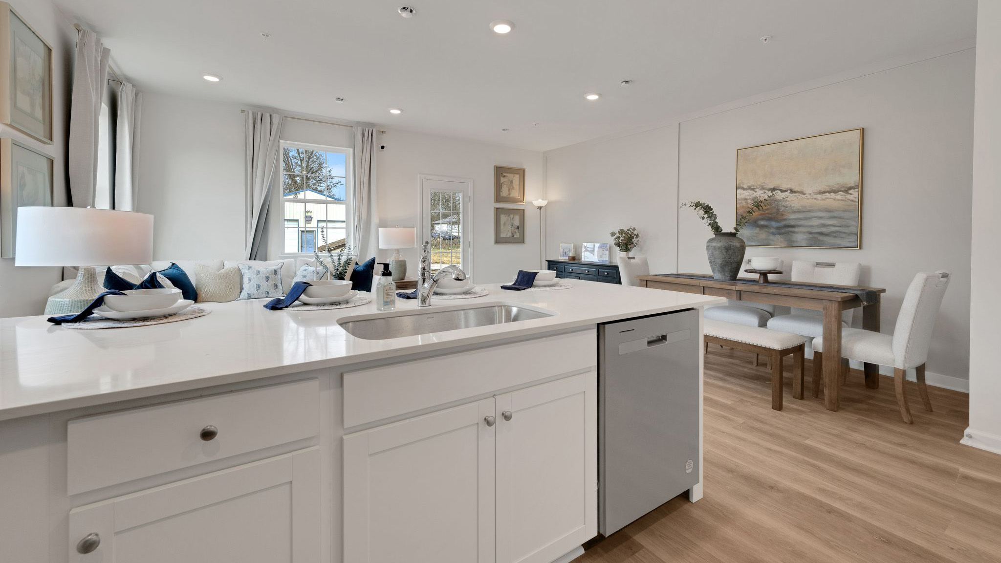 In the kitchen area behind the counter with the dining and living area visible.