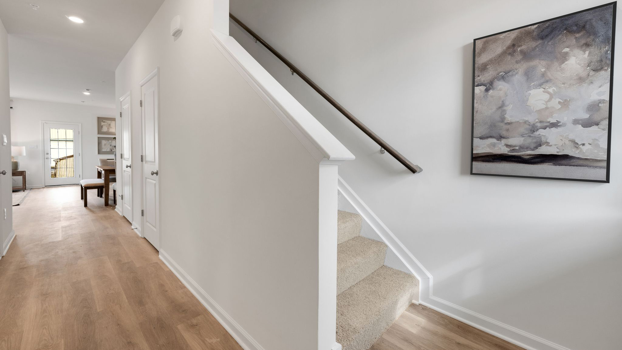 Bottom of the stairs looking up to the second floor.
