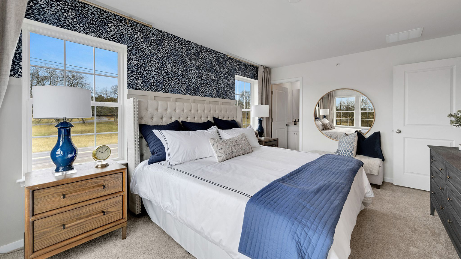 A different view of the primary bedroom with view to bathroom door.
