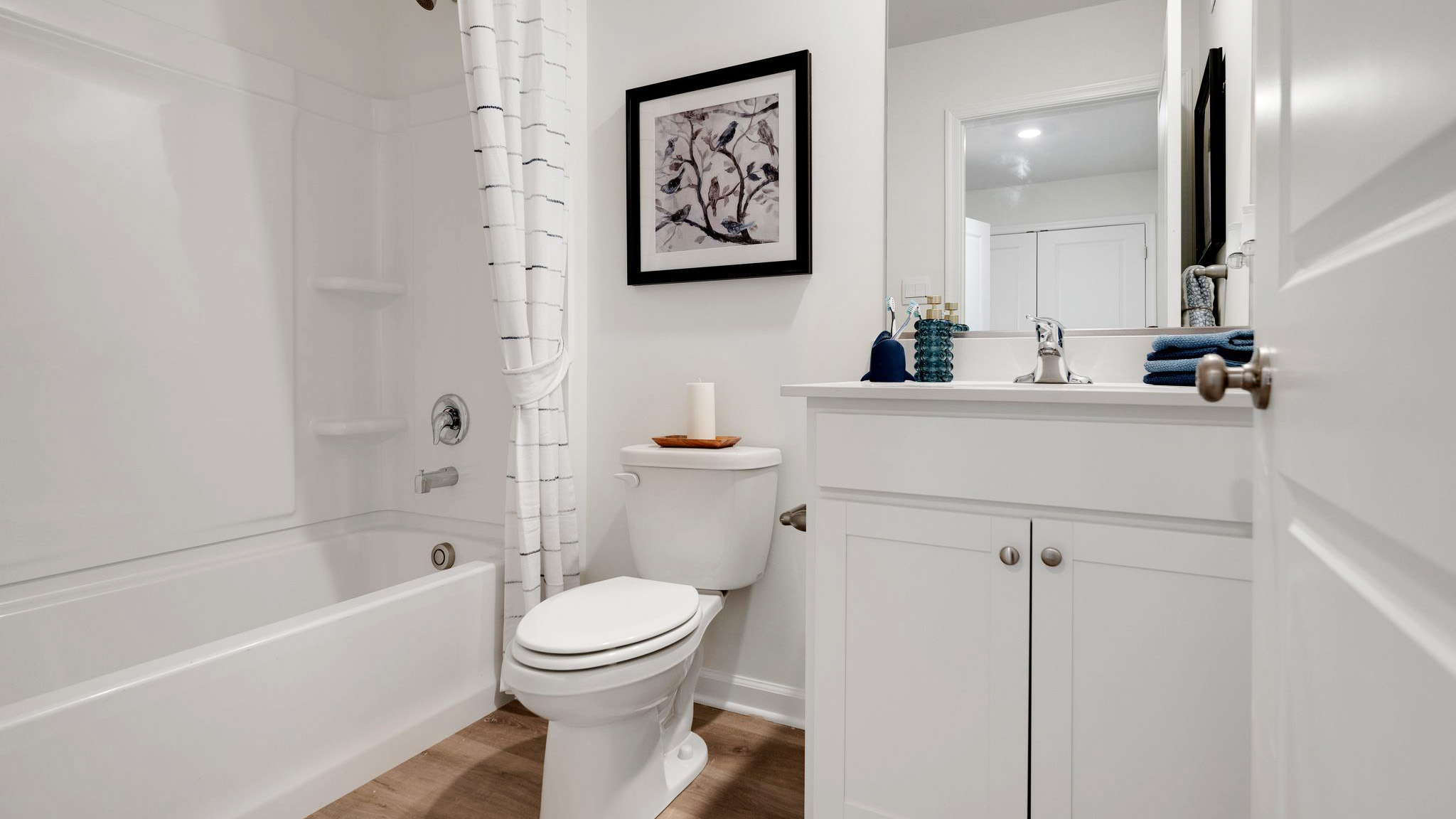 Full bath with single sink counter and vanity and bathtub.