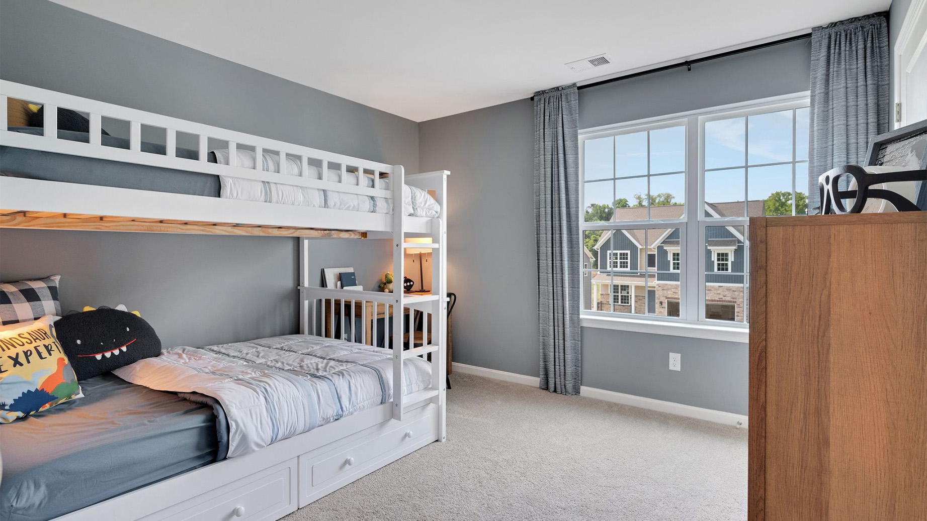 Three generously sized secondary bedrooms, and a hall bathroom with double vanity complete the upstairs.