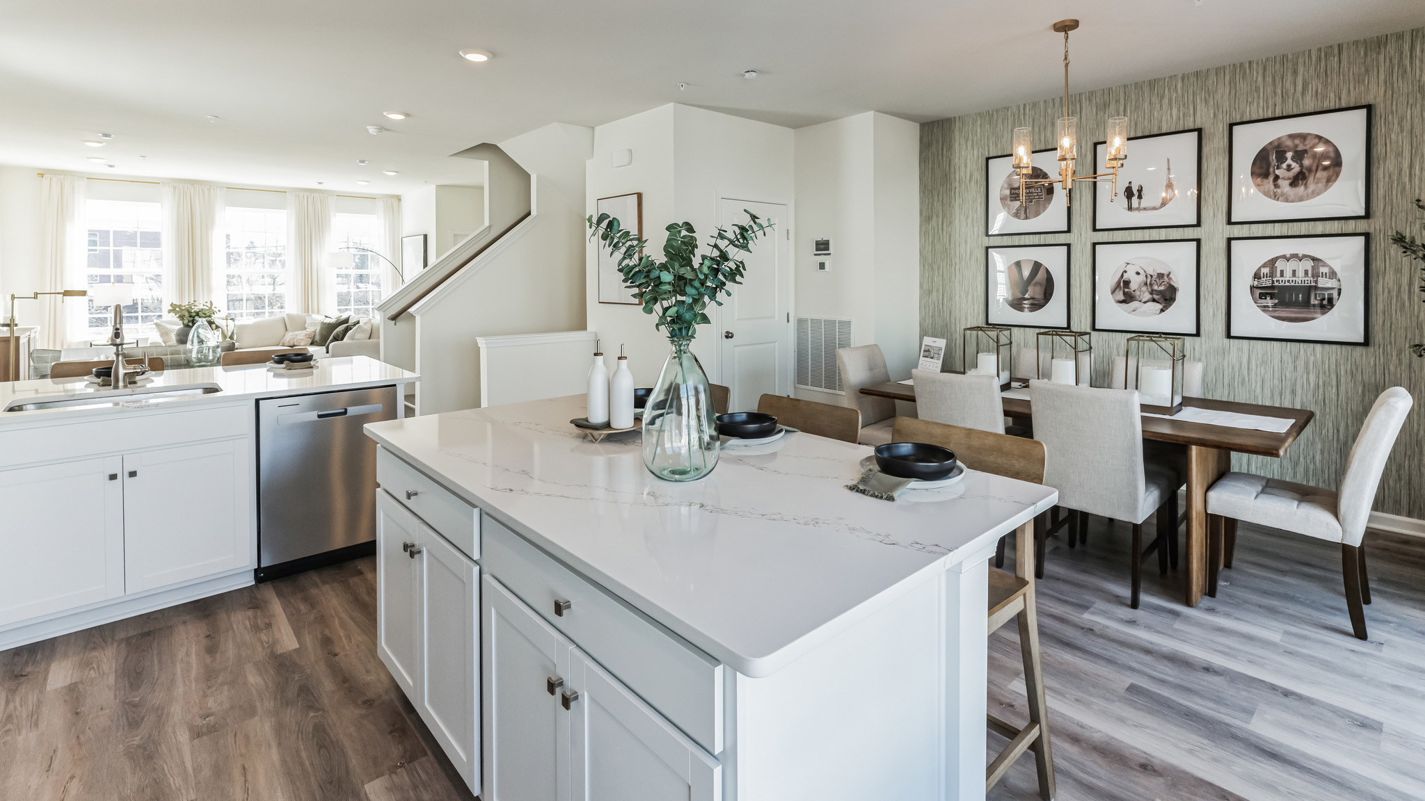 Kitchen area with large island that flows into the dining area.