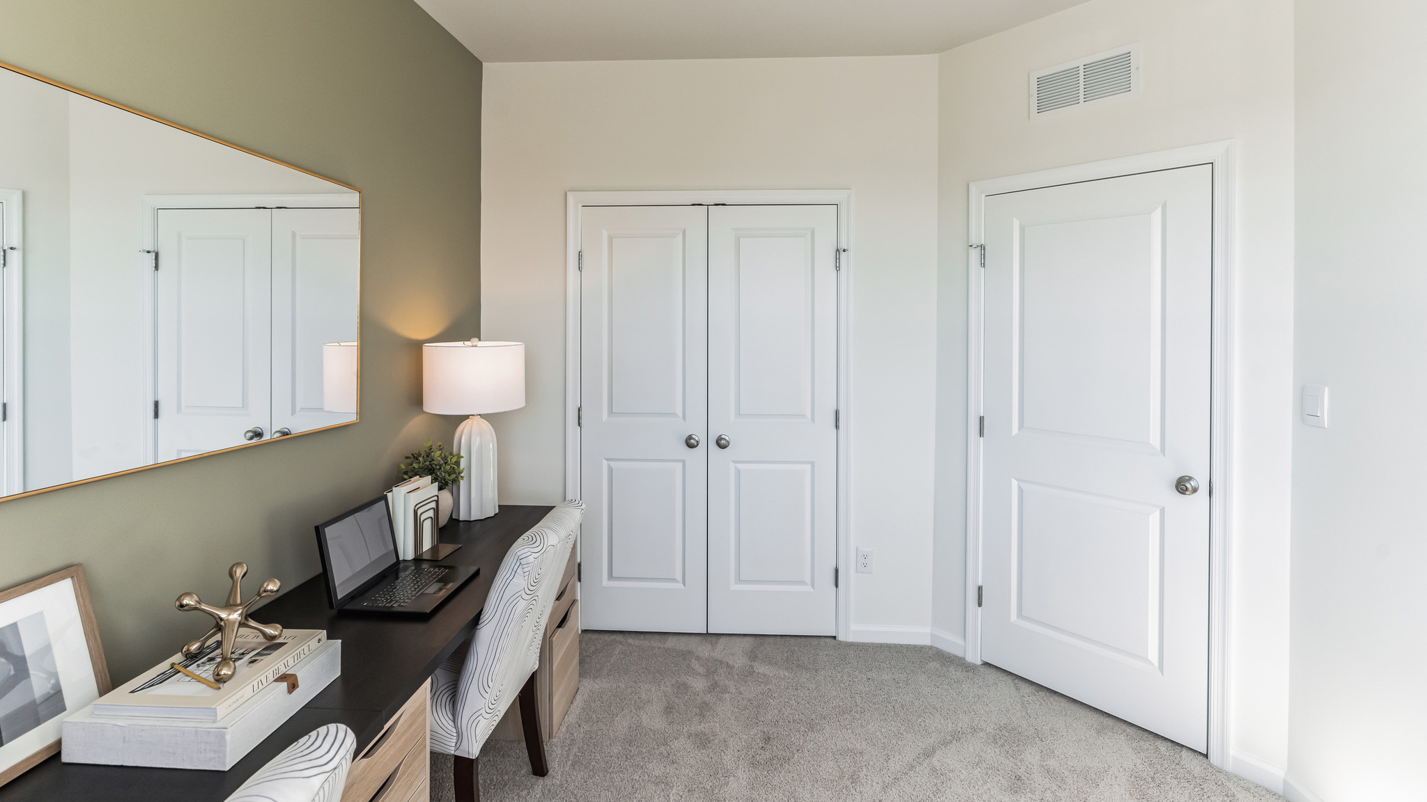 Bedroom two with a double door closet.