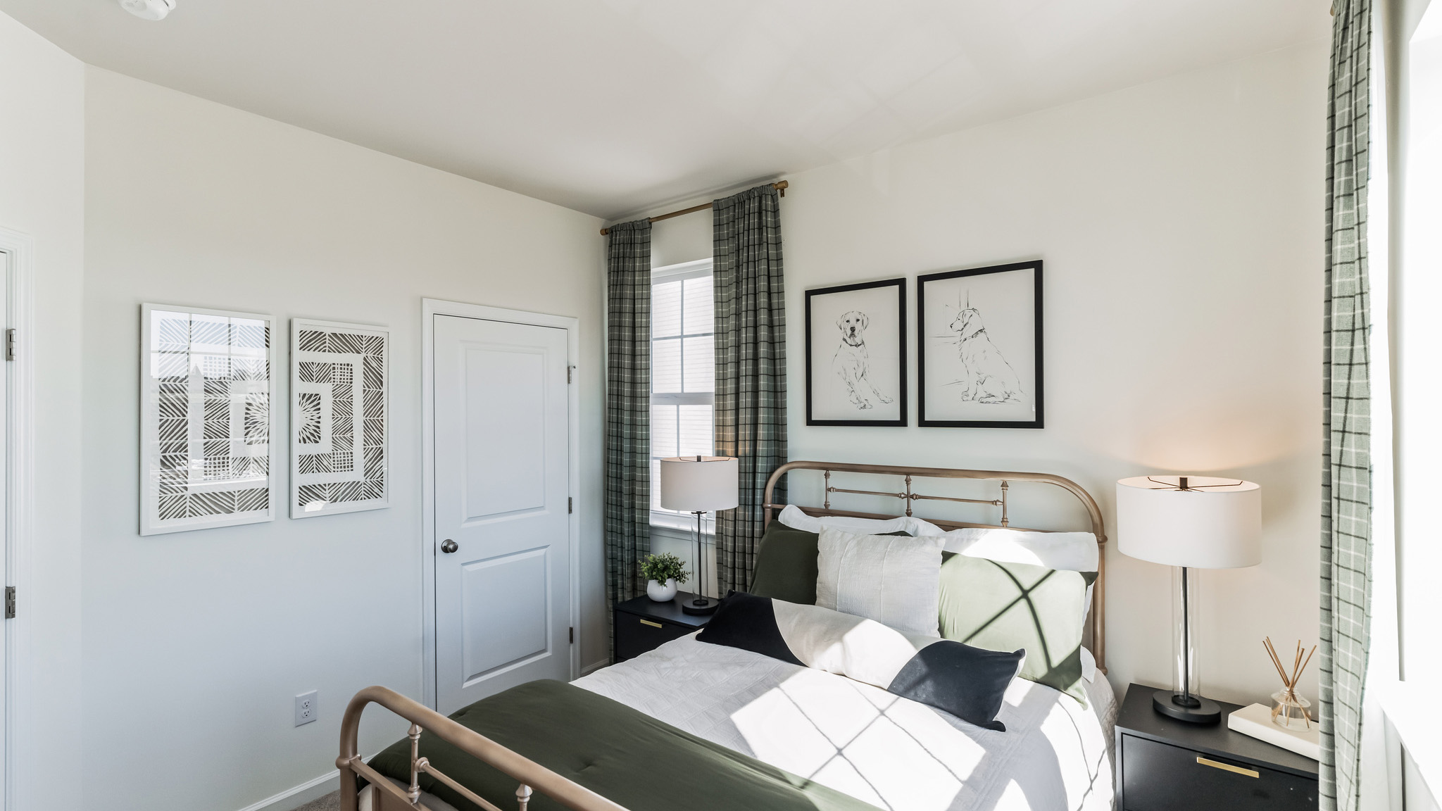 Different view of bedroom three with three windows and a single door closet.