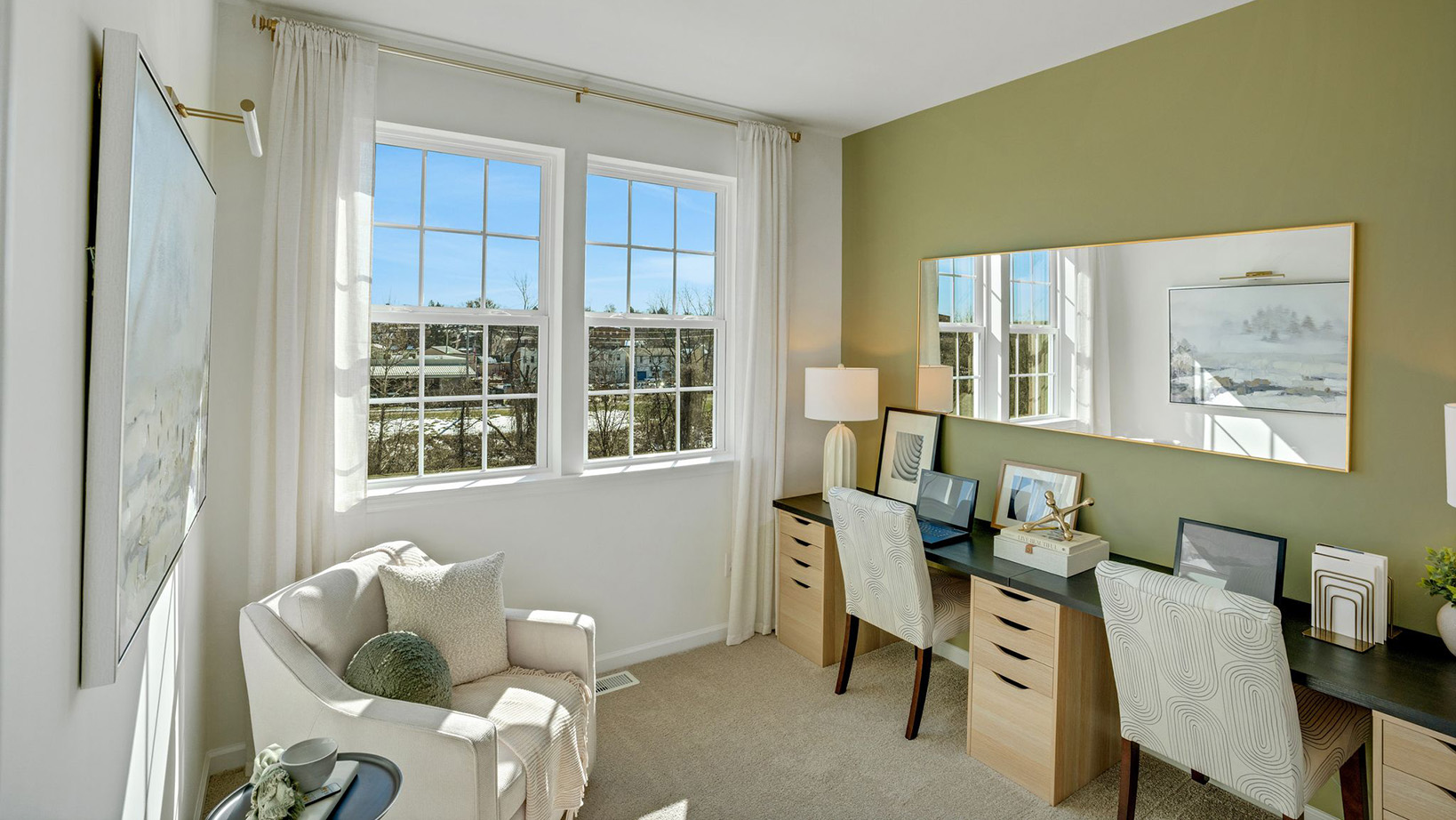 Bedroom two with two windows that can be used an office space.