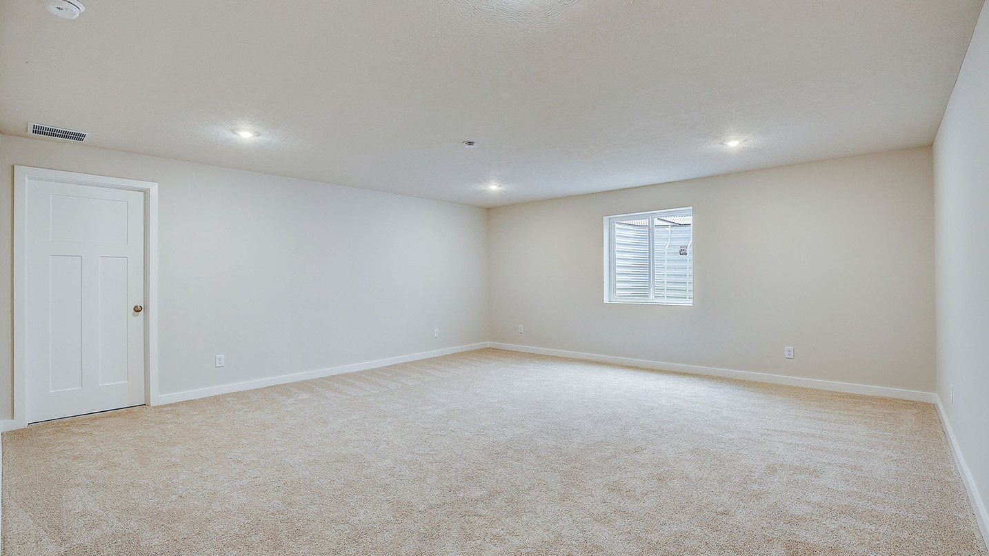 finished basement shown with egress window
