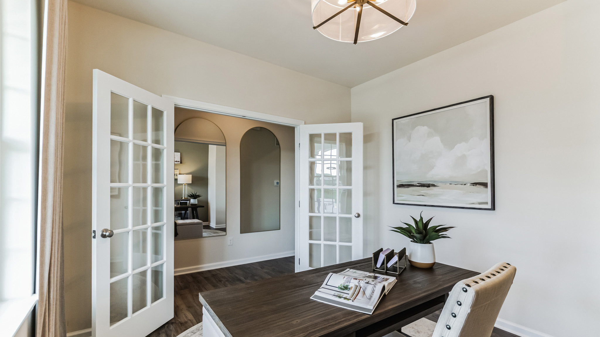 The flex room can be used as a home office. Large double window in the center of the back wall with built in shelves and built in seating.