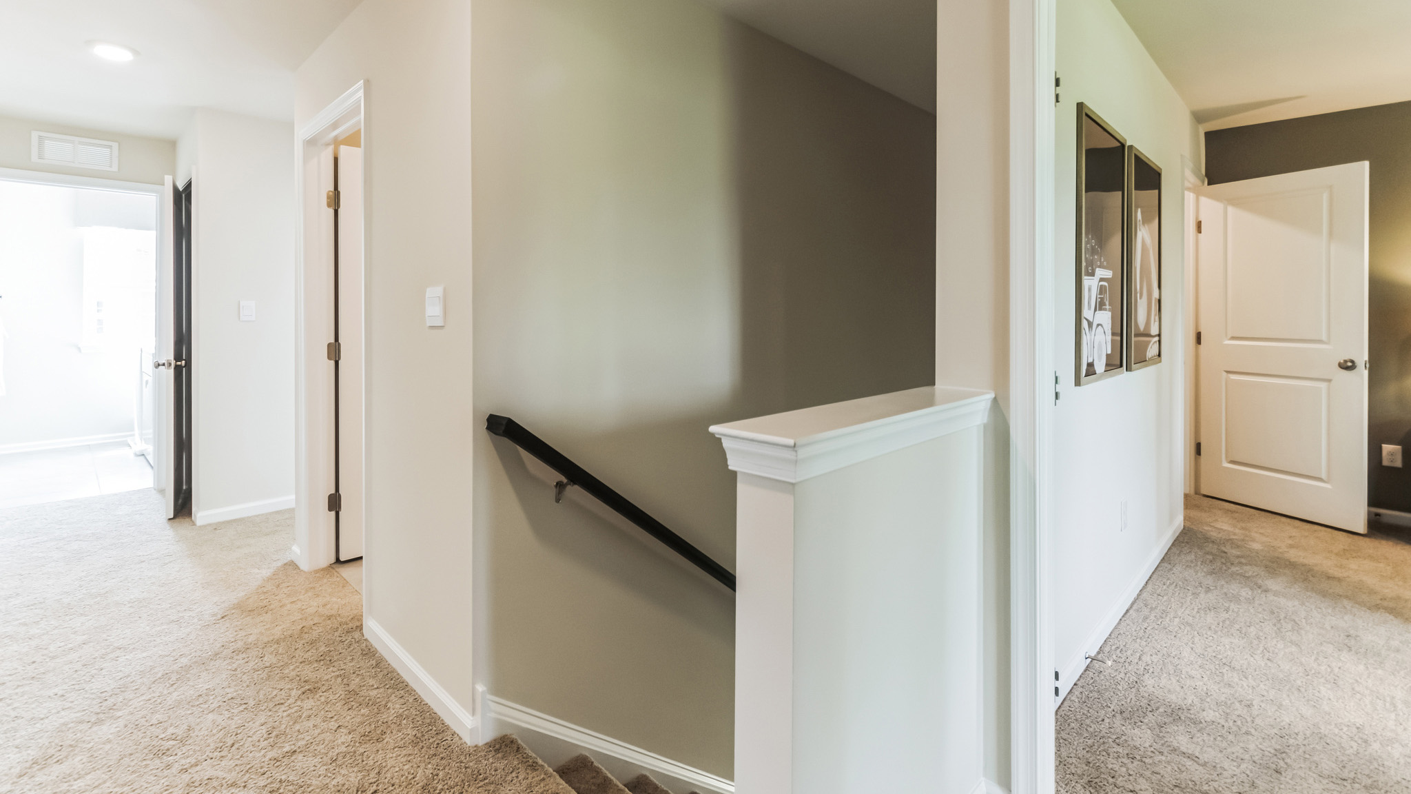 Second floor of stairs and bedrooms down both halls on either side of the stairs.