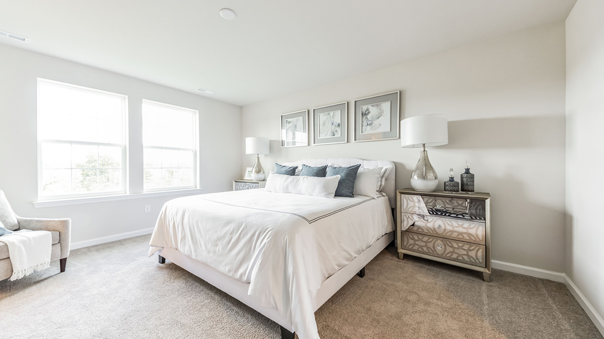 Bedroom with two double windows.
