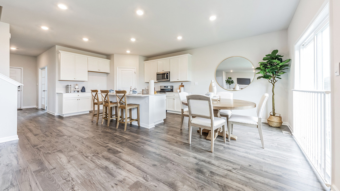 Image of the dining and kitchen area standing next to the sliding back door.