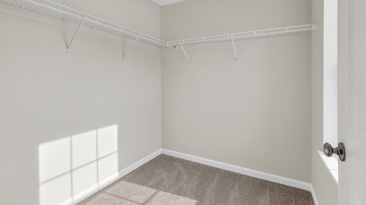 Primary bedroom walk-in closet.