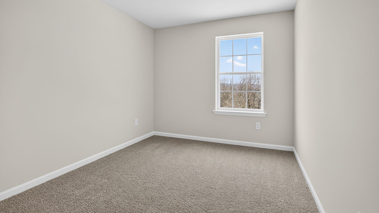 The second bedroom with single window.