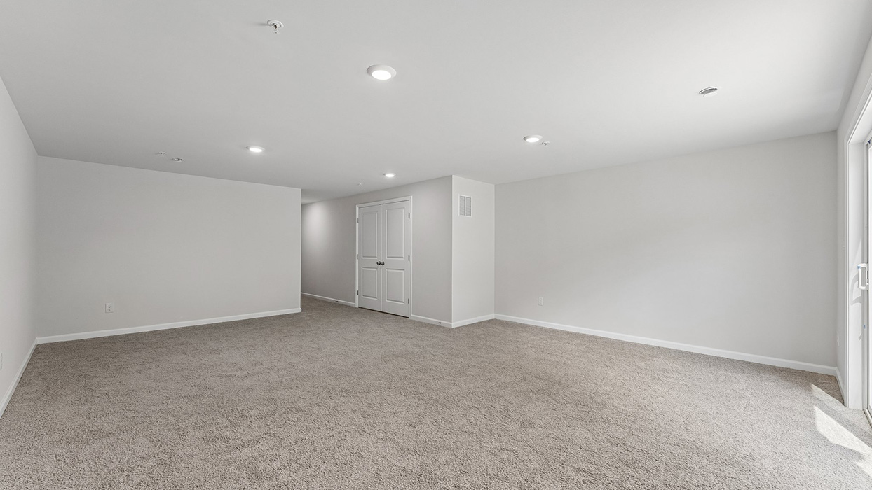 Finished basement with sliding walkout door