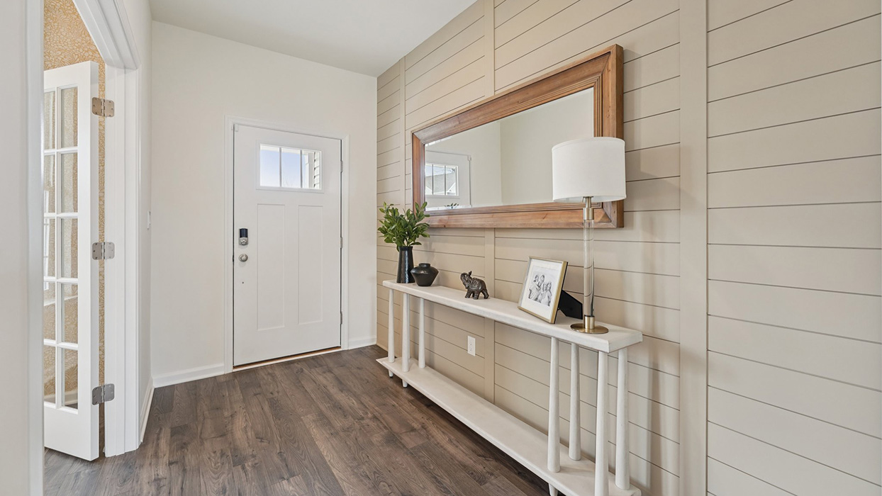 This well-designed home has an inviting foyer that is open to the functional study.