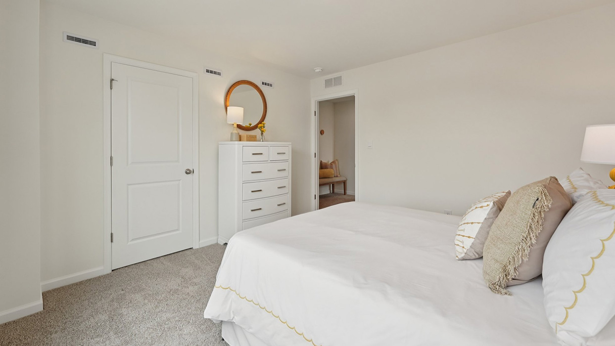 Three generously sized secondary bedrooms, and a hall bathroom with double vanity complete the upstairs.