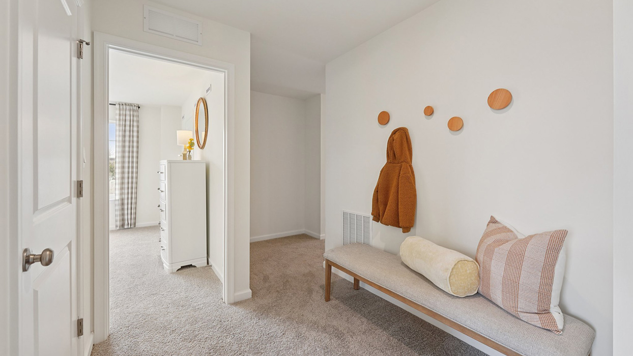 Three generously sized secondary bedrooms, and a hall bathroom with double vanity complete the upstairs.