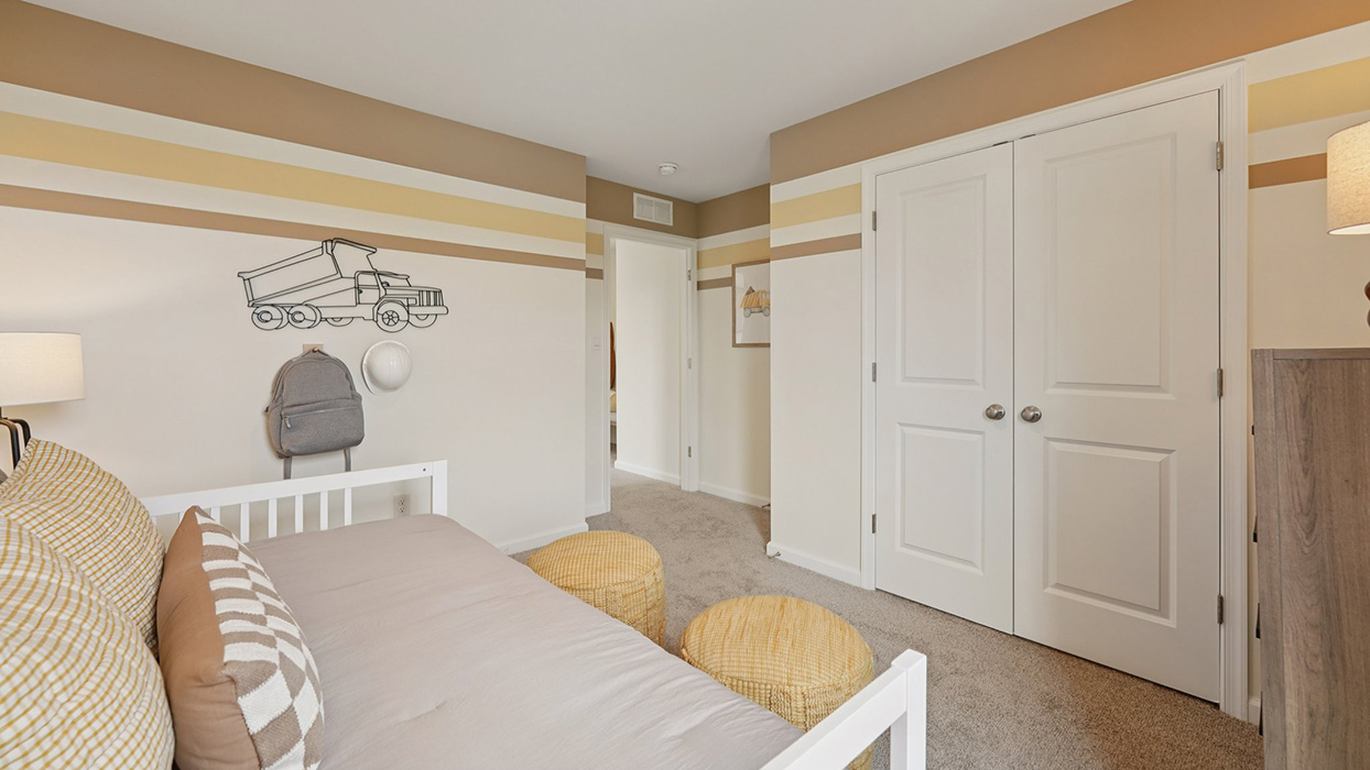 Three generously sized secondary bedrooms, and a hall bathroom with double vanity complete the upstairs.