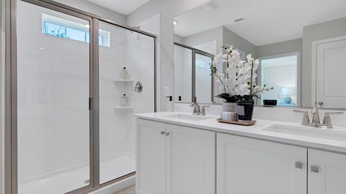 A contemporary owner’s bathroom with a large shower.