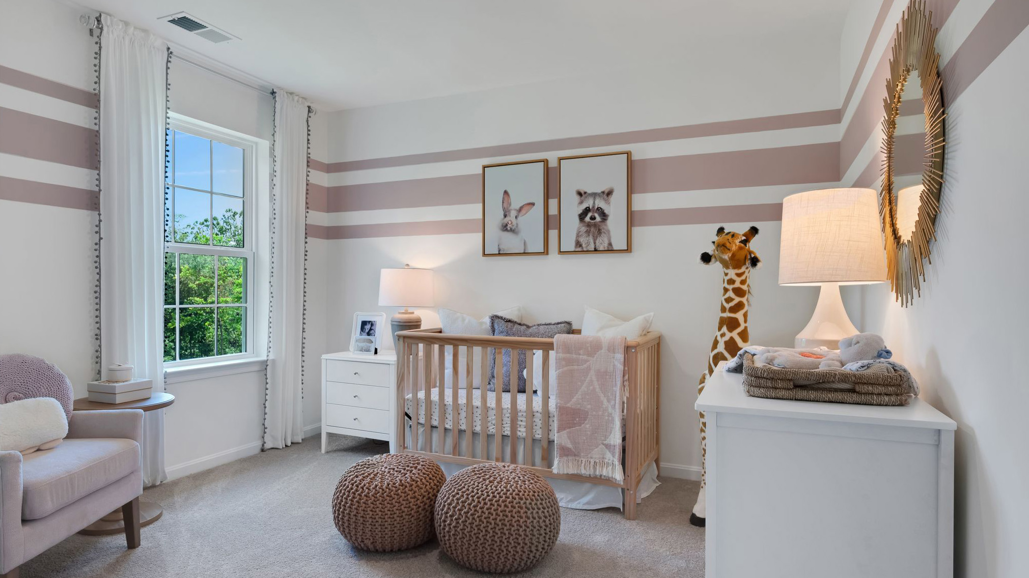 Three generously sized secondary bedrooms, and a hall bathroom with double vanity complete the upstairs.