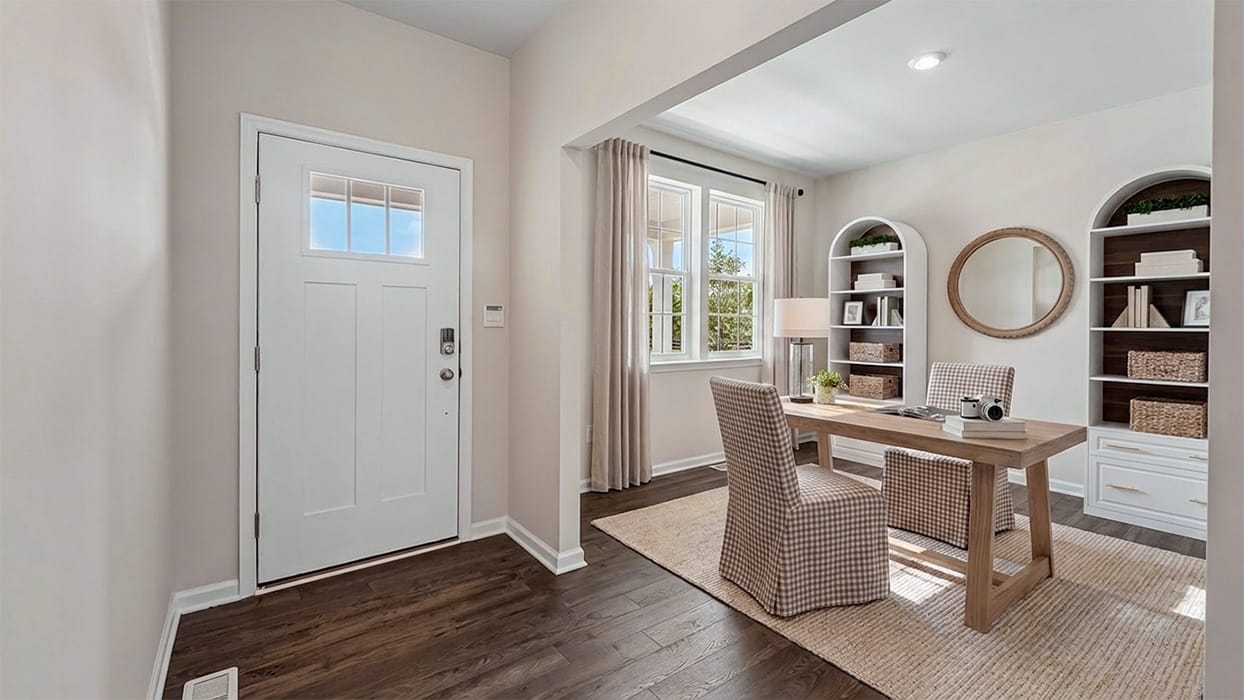 Entry foyer with natural light, front door window panel, and durable wood-look flooring leading into open-concept layout