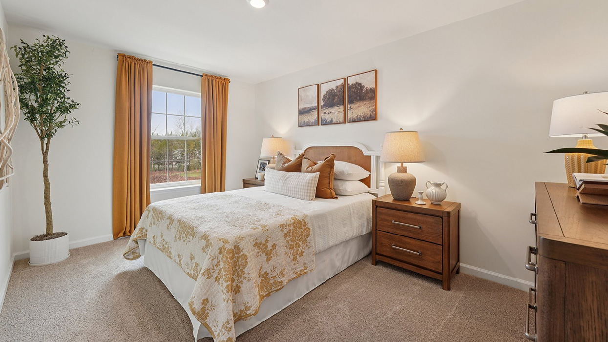 Three generously sized secondary bedrooms, and a hall bathroom with double vanity complete the upstairs.