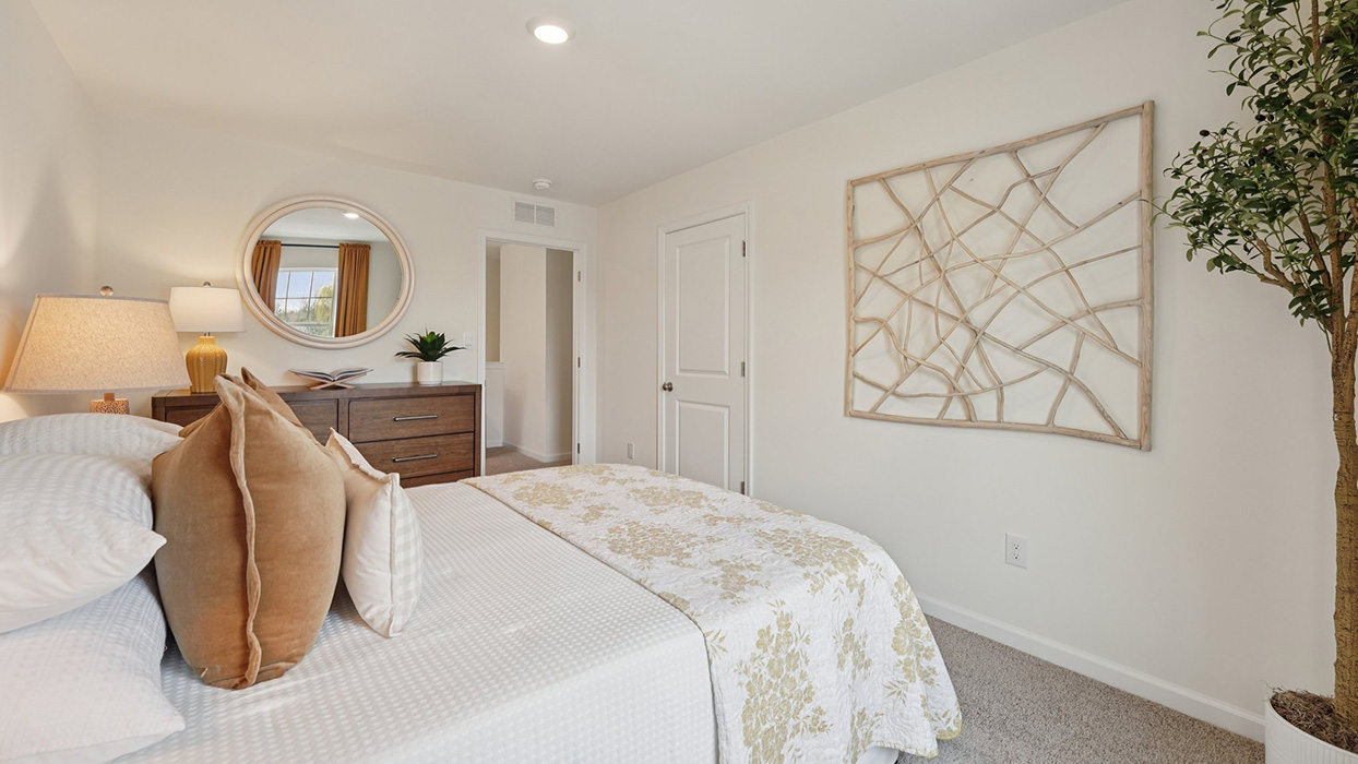 Three generously sized secondary bedrooms, and a hall bathroom with double vanity complete the upstairs.