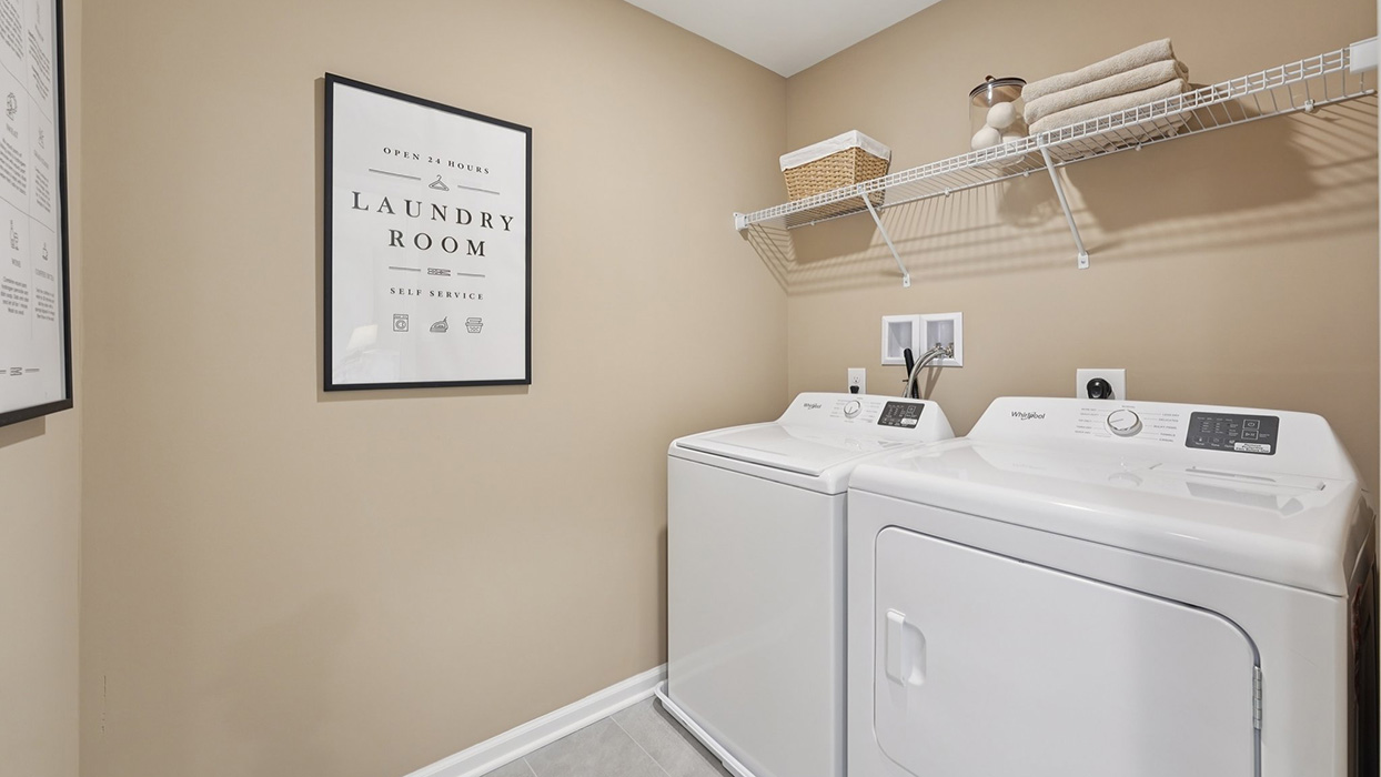 Three generously sized secondary bedrooms, and a hall bathroom with double vanity complete the upstairs.