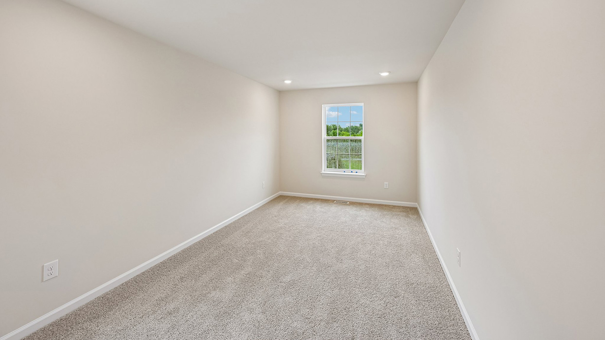 Bedroom with carpet flooring, single window, and clean neutral finishes