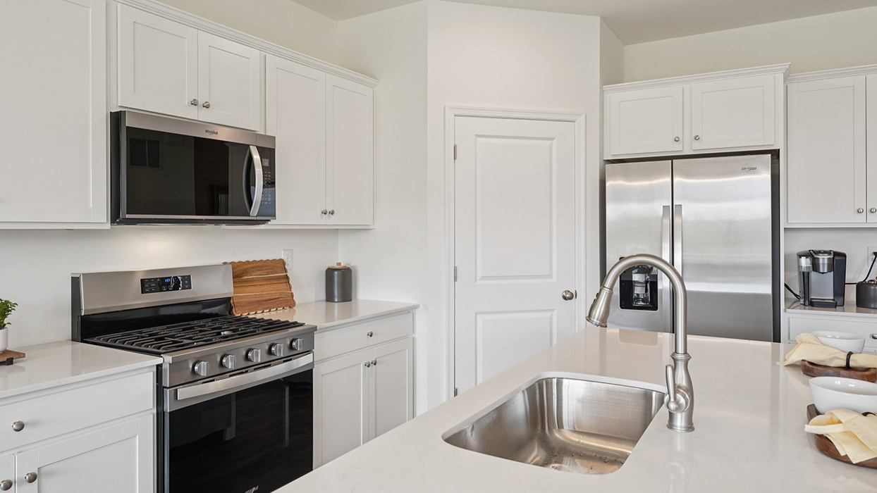 The well-designed gourmet kitchen features a corner pantry.