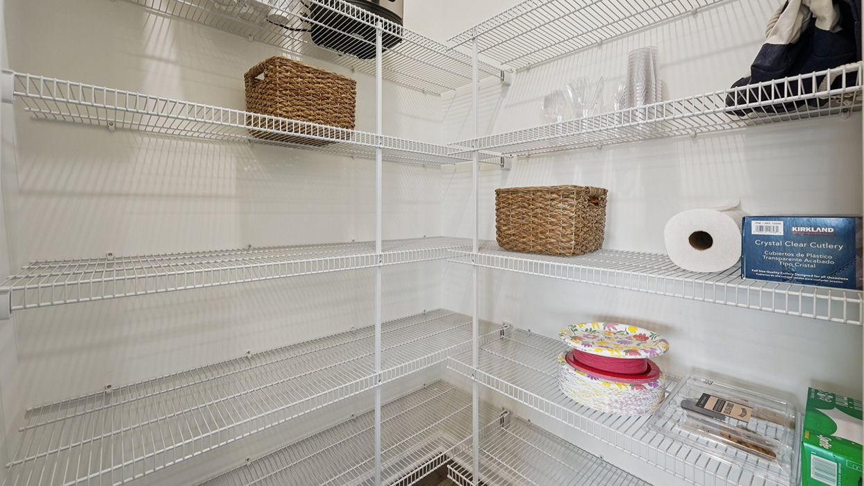 The pantry with racks for food and supply storage.
