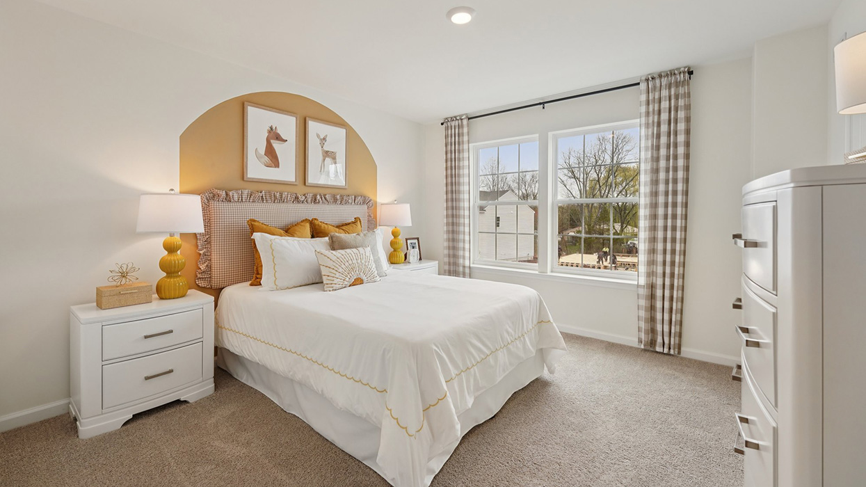 Three generously sized secondary bedrooms, and a hall bathroom with double vanity complete the upstairs.