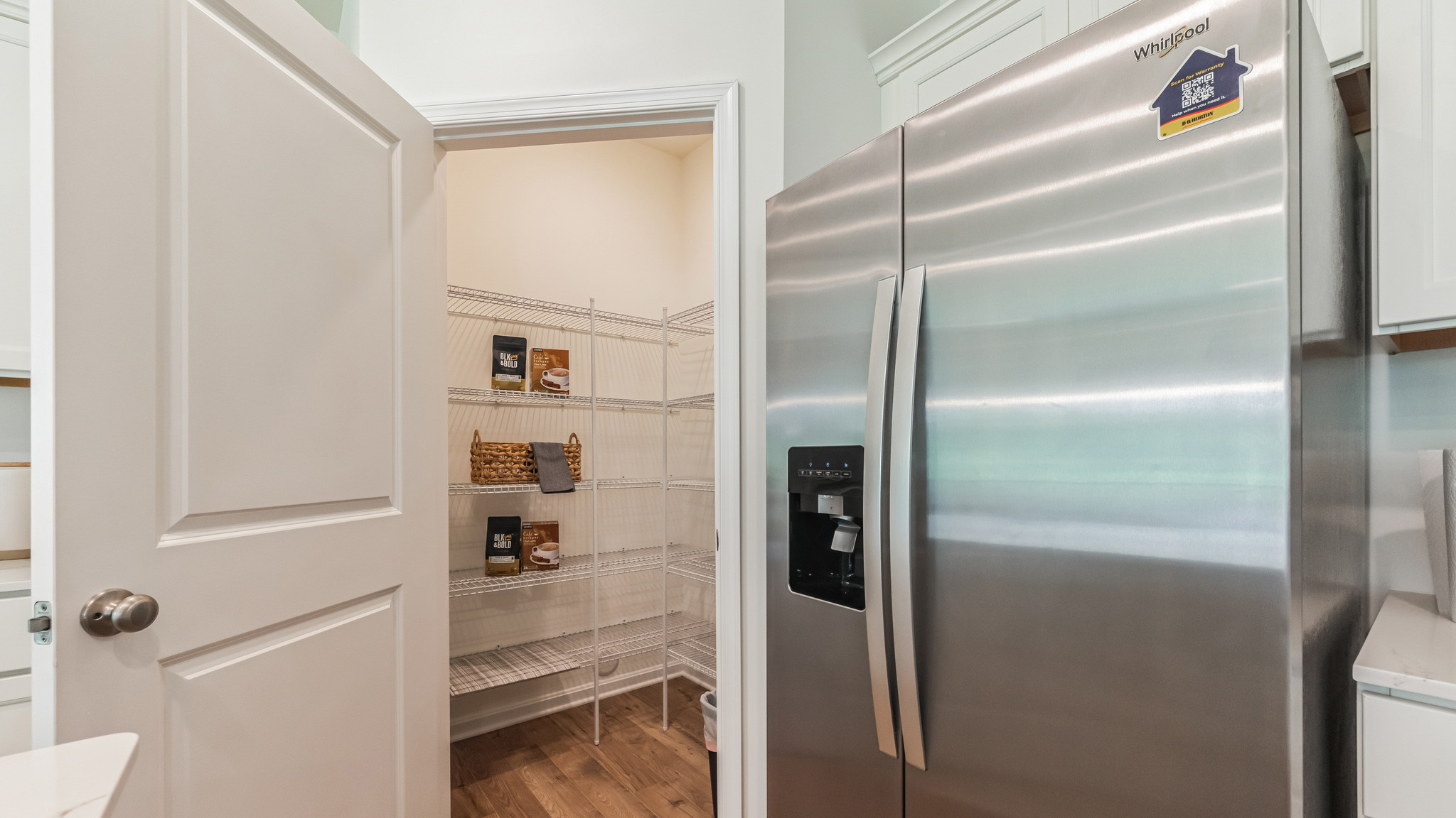 The well-designed gourmet kitchen features an oversized corner pantry.