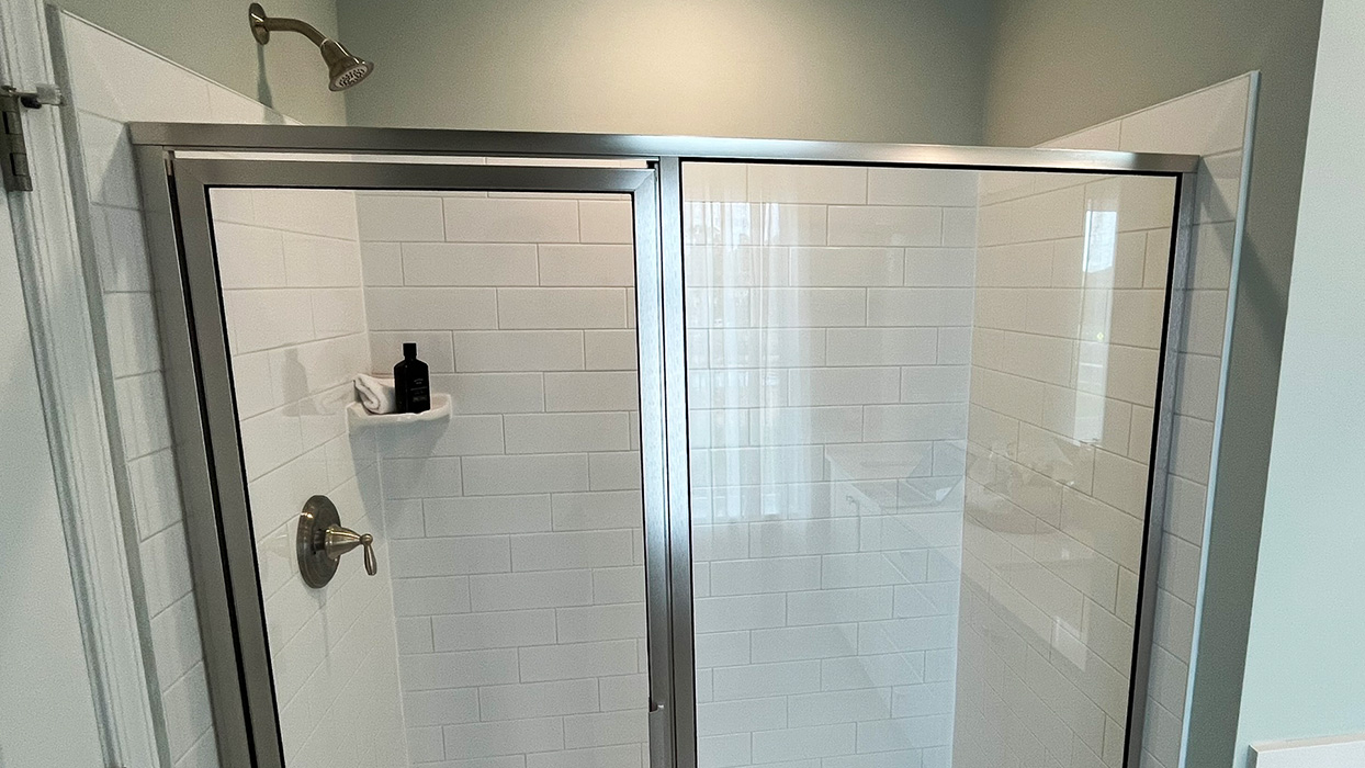 Glass door shower that's connected to the bedroom on the third floor.