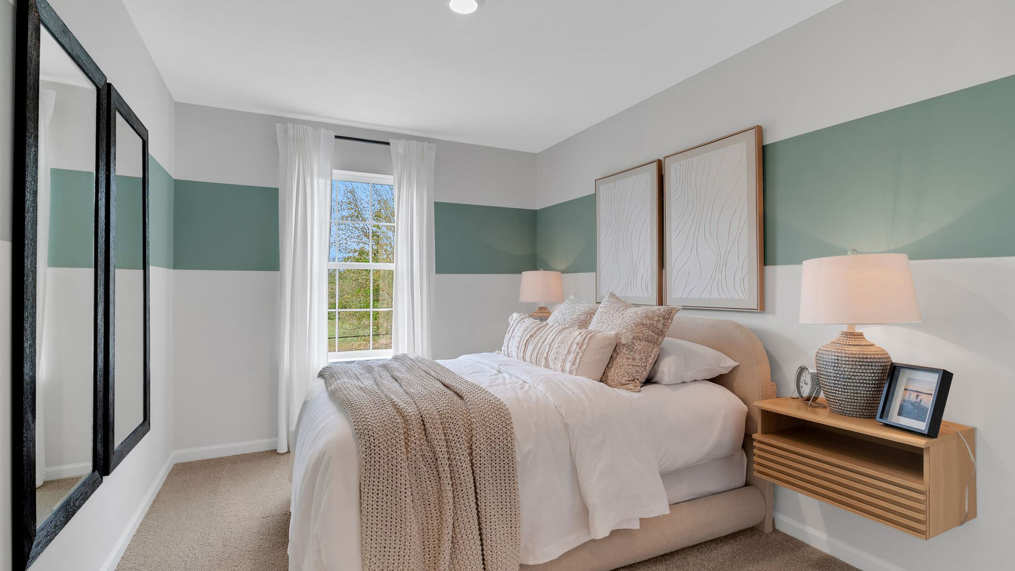 Third floor bedroom with a single window.
