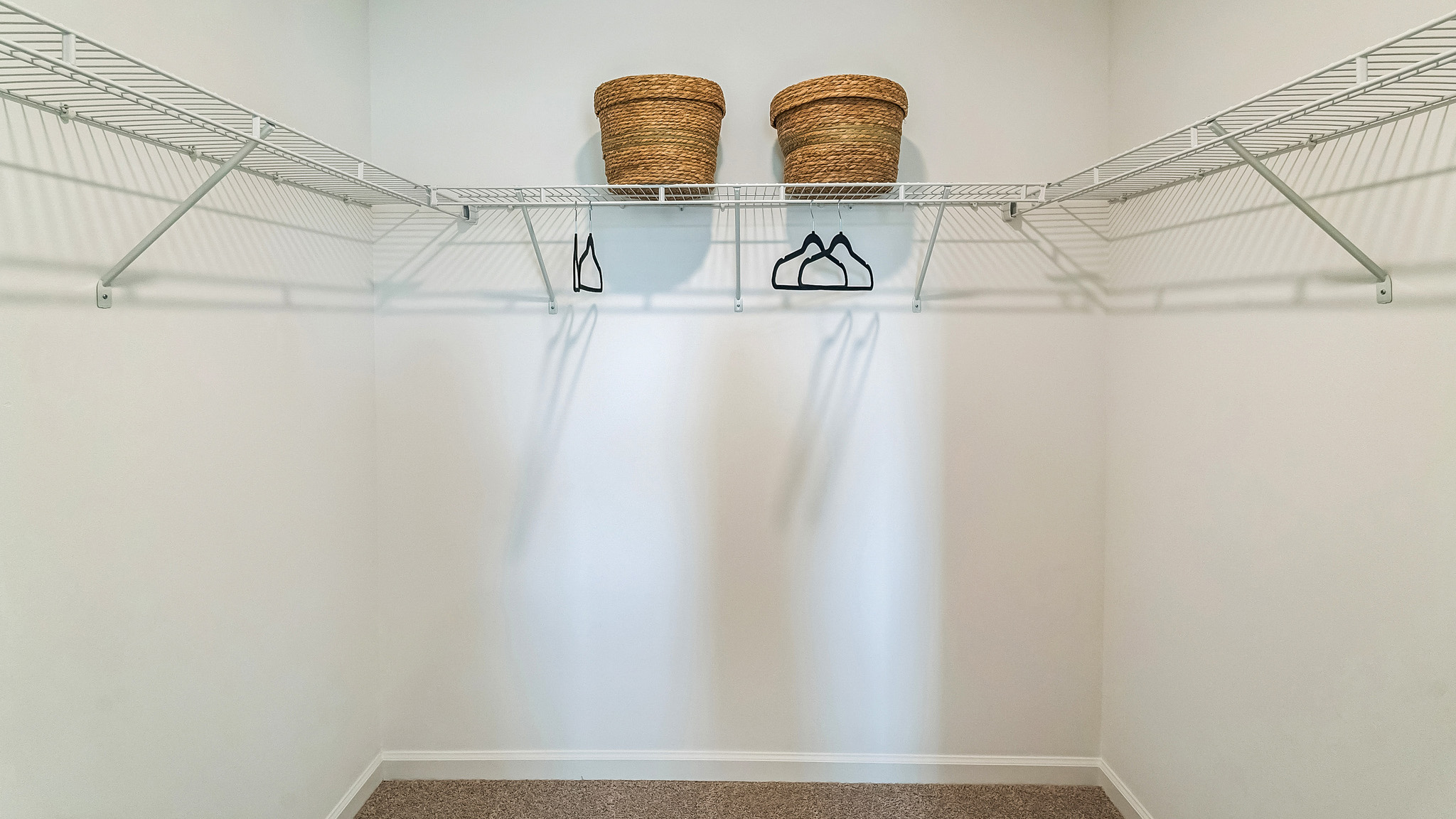 Large closet with racks and shelves.