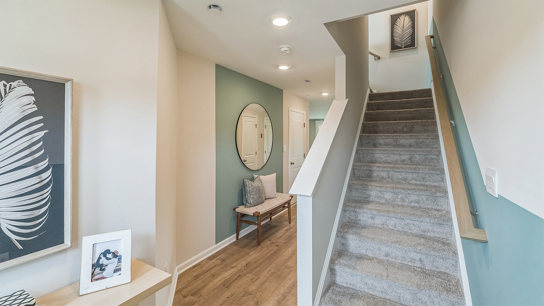 Stairwell from the first floor and hall leading into a bedroom.