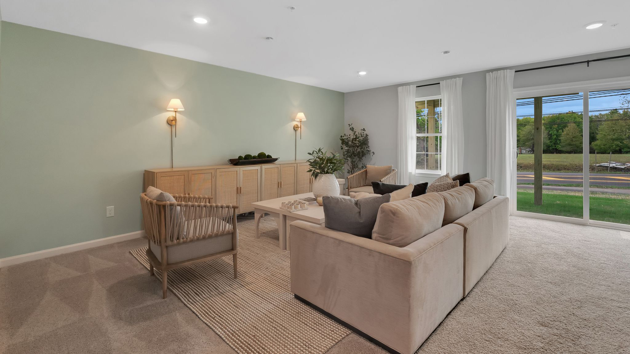 Different view of the lounge area on the first floor with back sliding glass door.