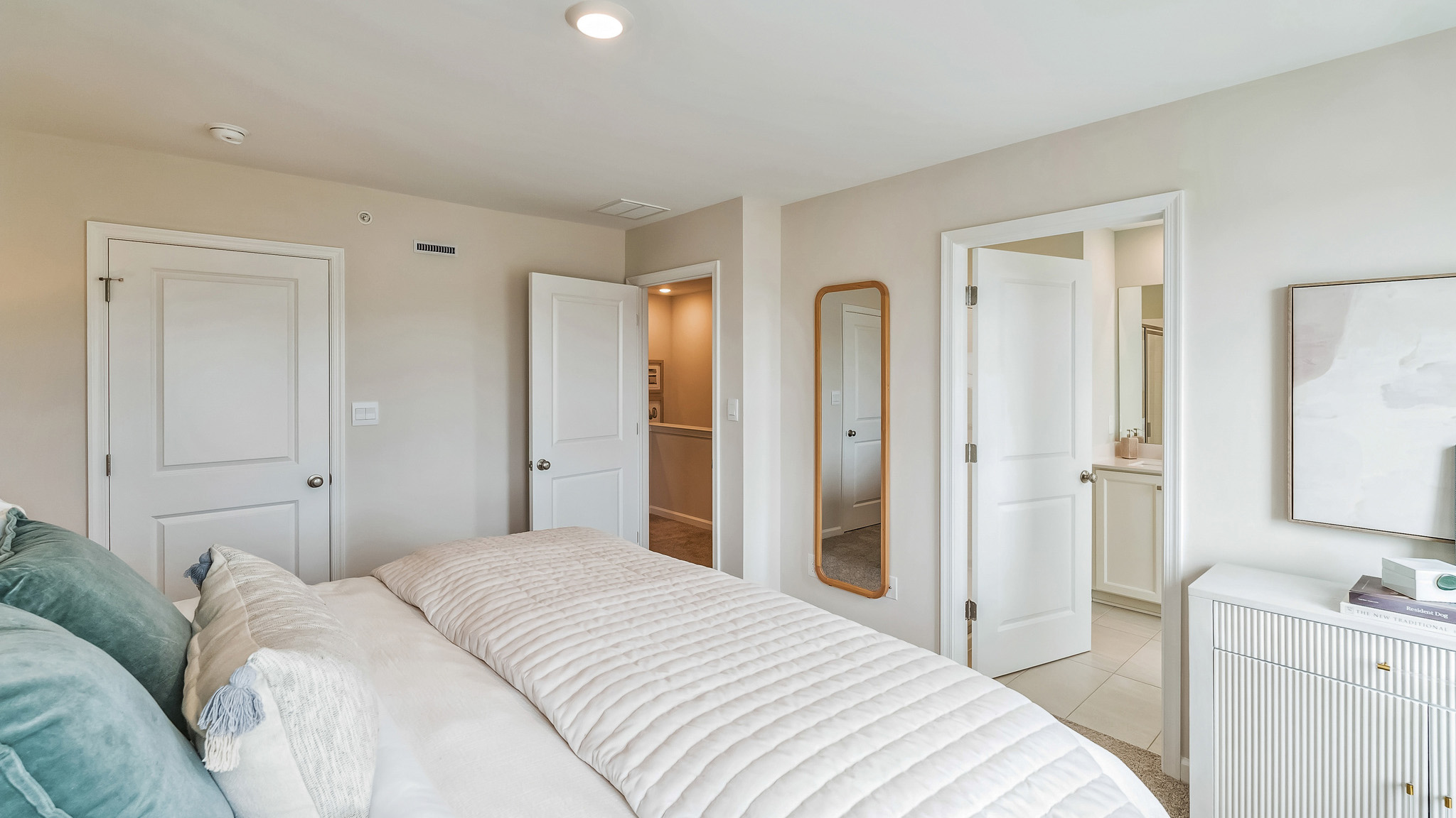 Third floor bedroom with closet and connecting bathroom.