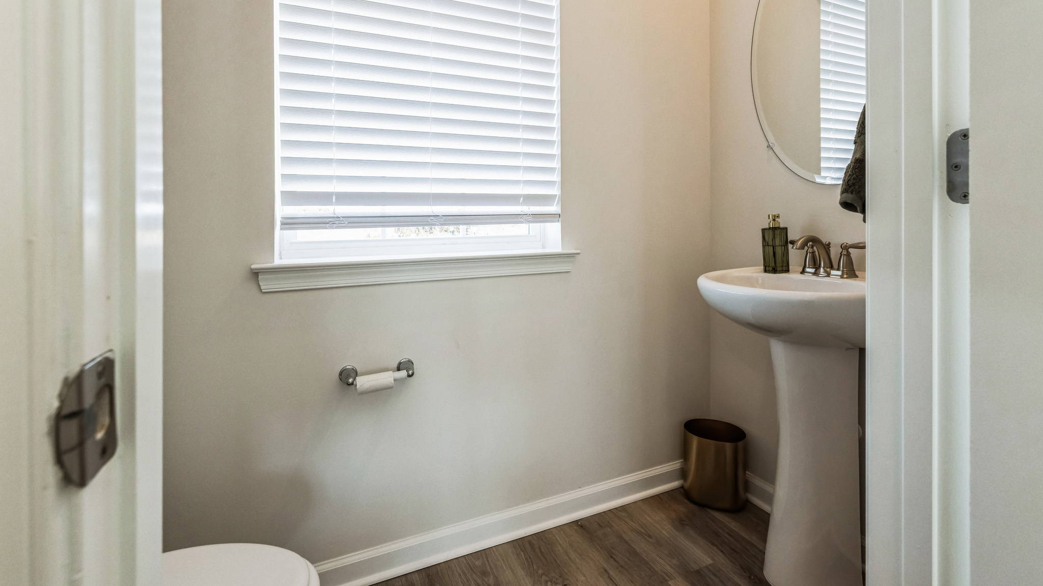 The powder room is located off the Living room area.