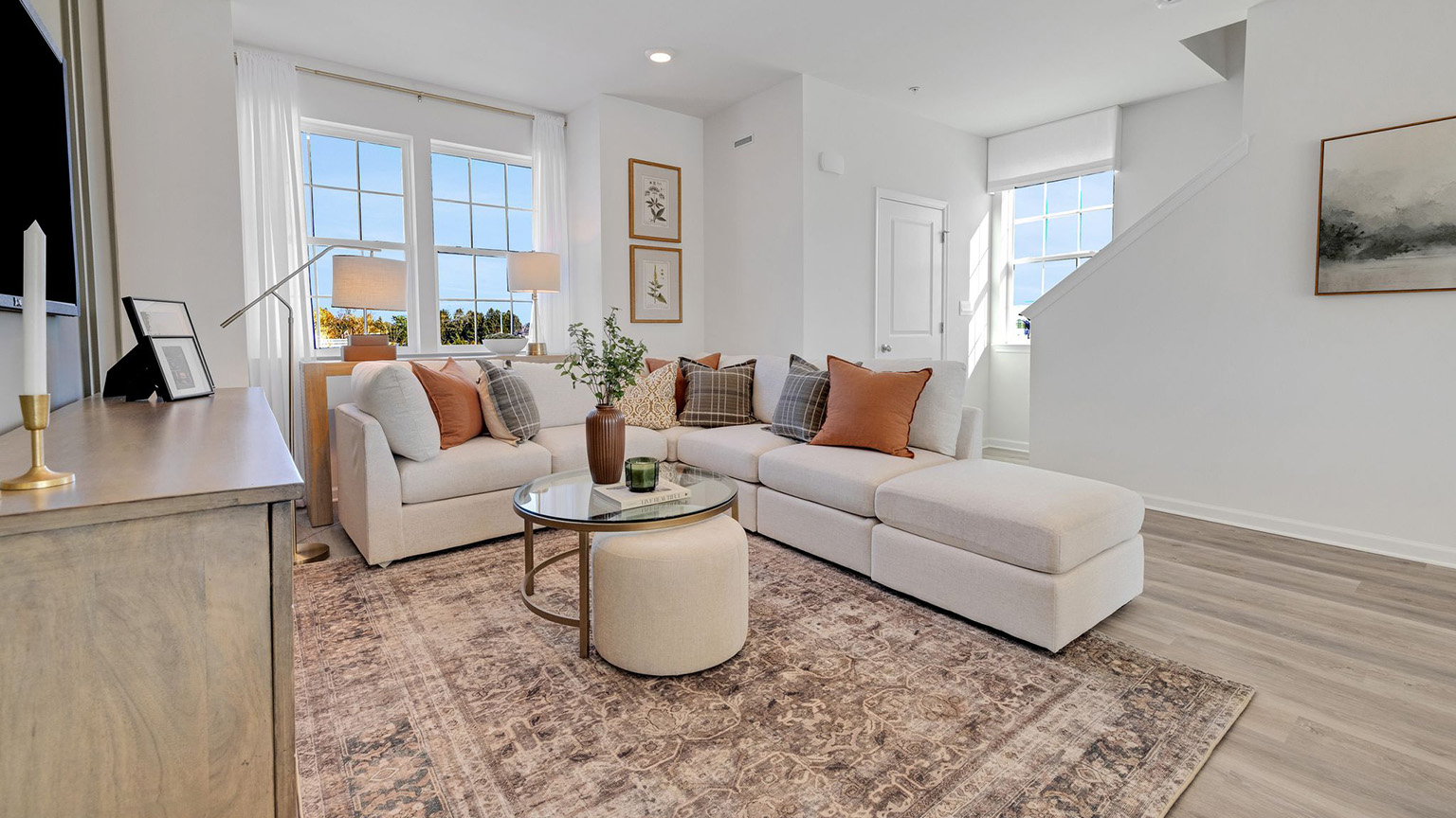 Living area with three tall windows.