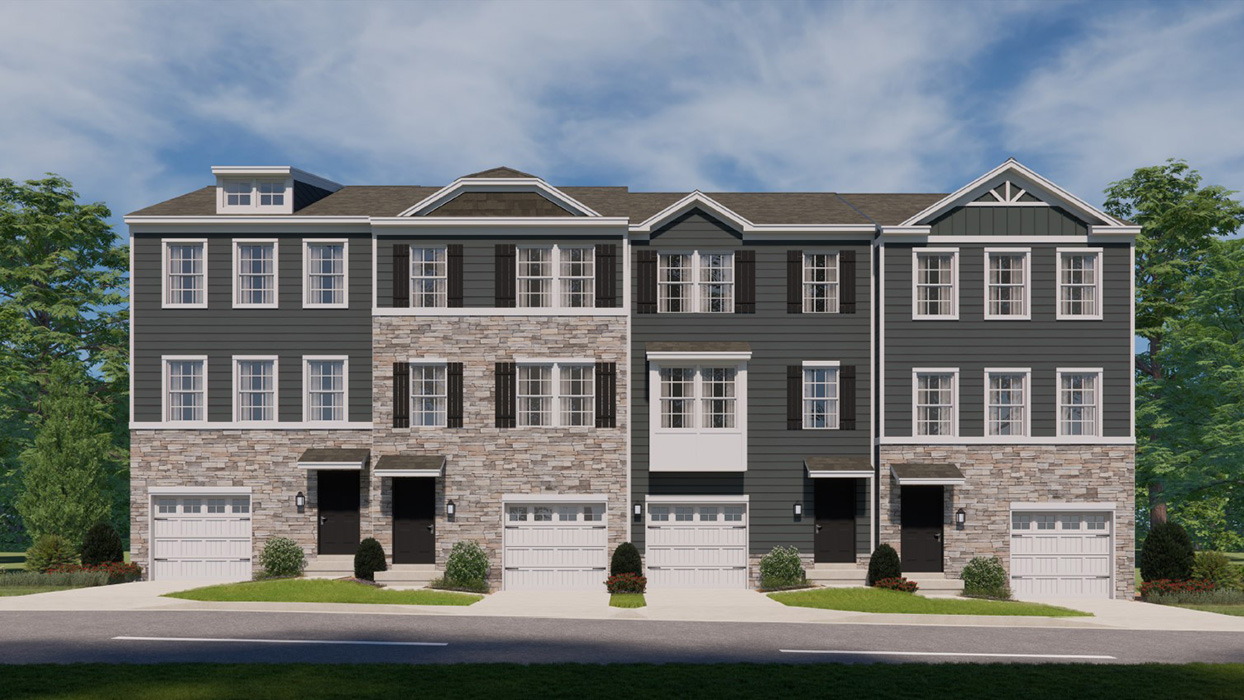 Exterior front image of four connecting townhomes with stone and gray horizontal paneling with white single car garage.