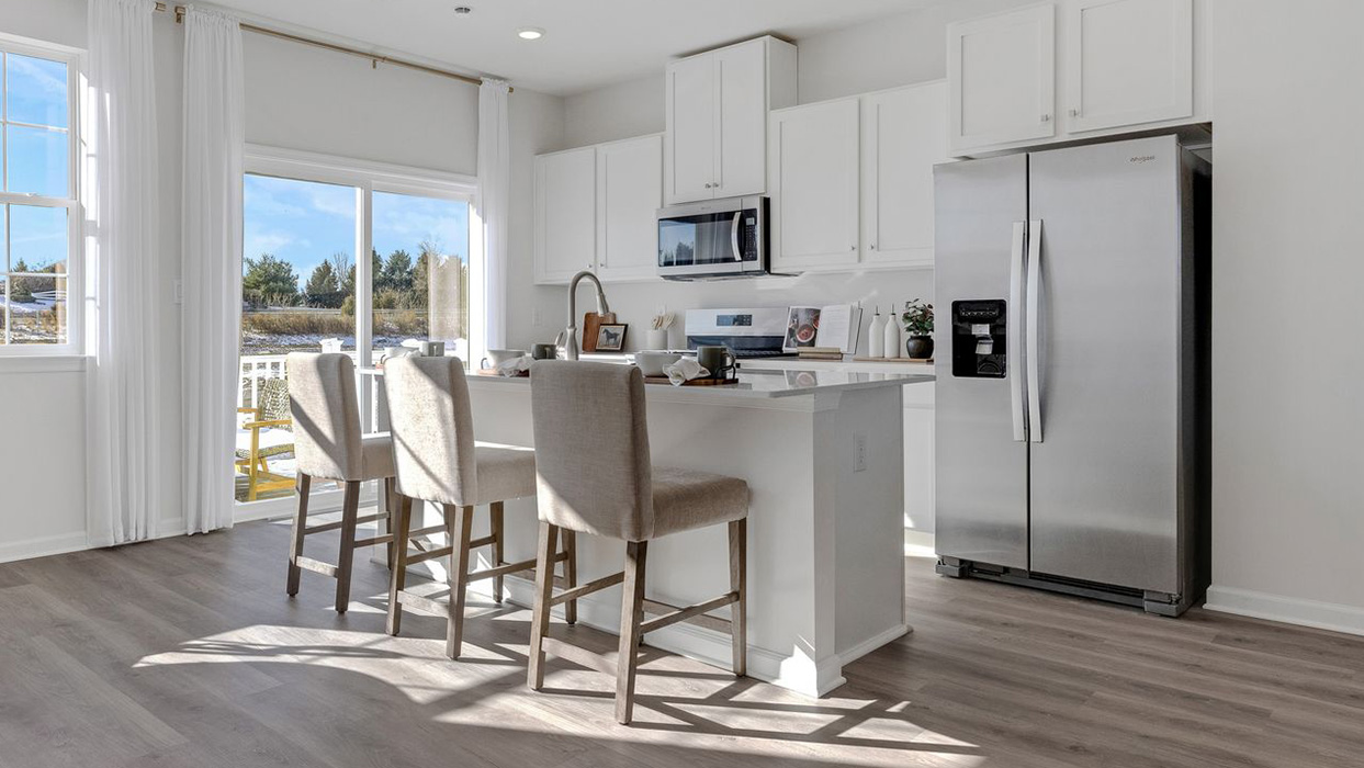 Kitchen area with sliding glass door and spacious deck on the back